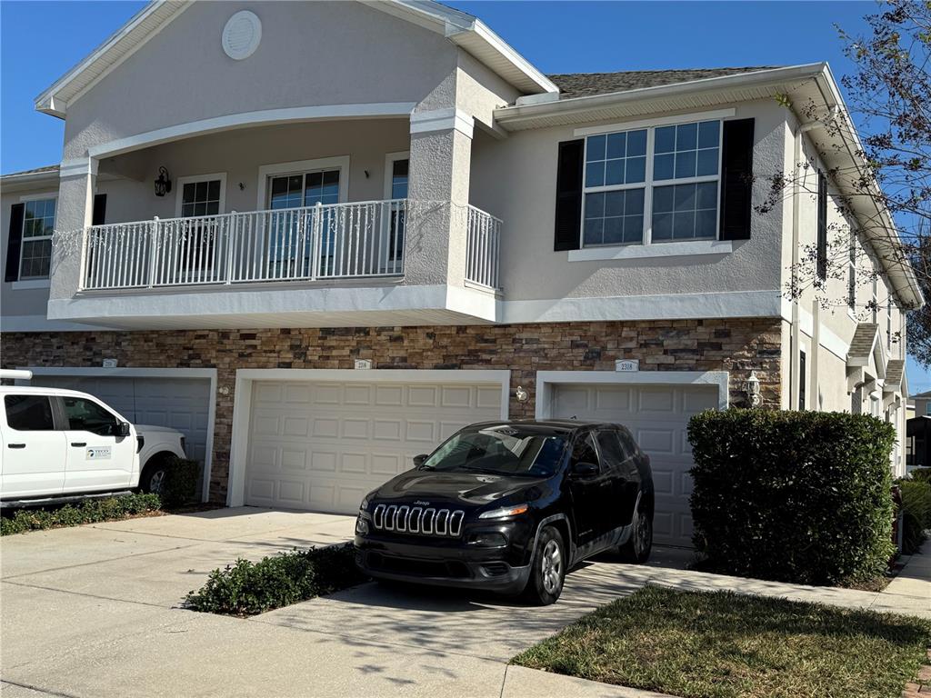 2318 Tanbark Ridge Place, Unit 2318 Plant City, FL 33563 - Photo 61 of 64 a car parked in front of a house