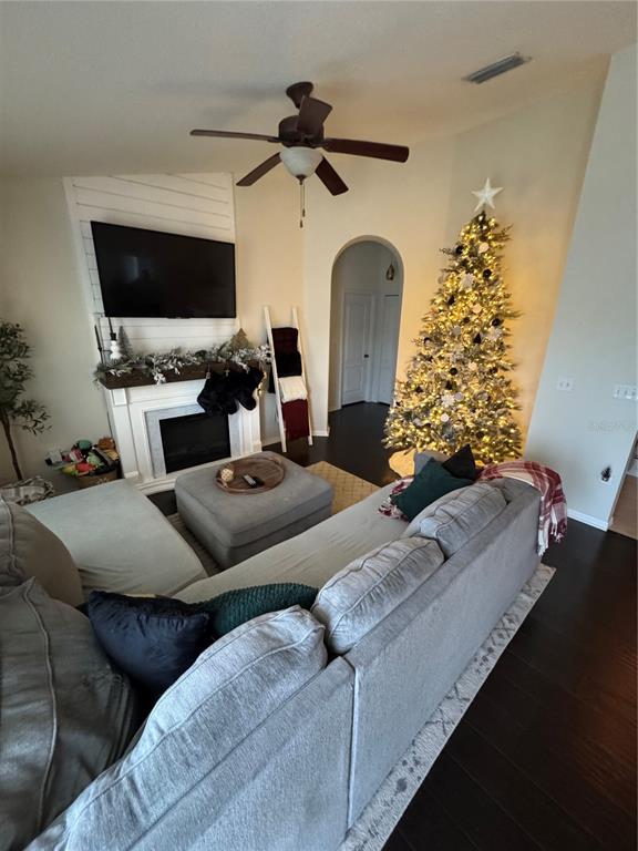 2318 Tanbark Ridge Place, Unit 2318 Plant City, FL 33563 - Photo 62 of 64 a living room with furniture and a flat screen tv