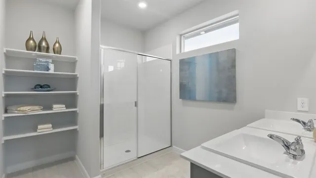 a bedroom with furniture and a chandelier