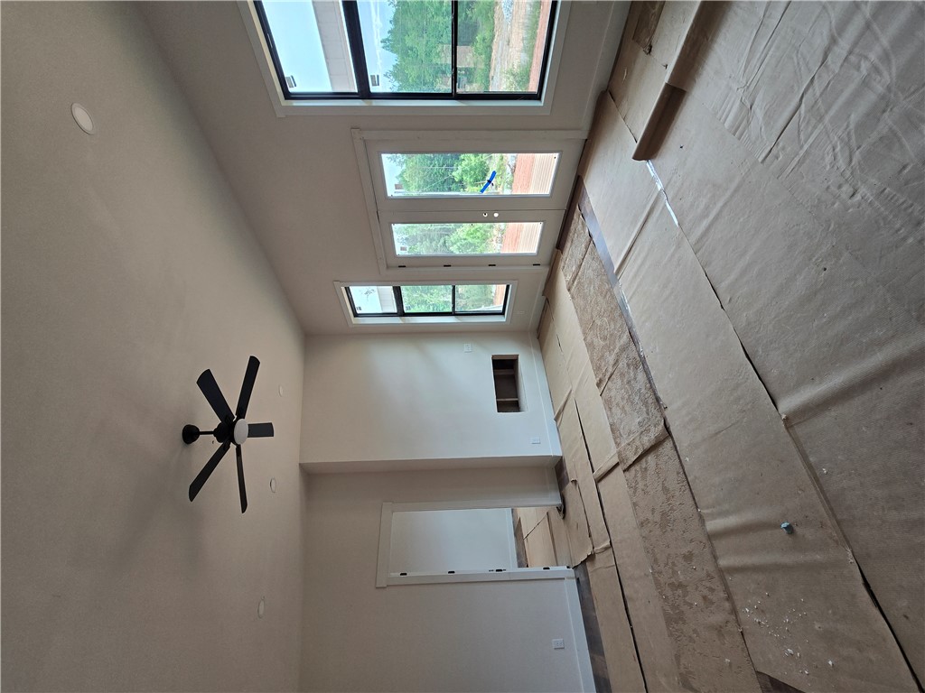 157 Hunting Hollow Road Six Mile, SC 29682 - Photo 16 of 19 Lofty ceilings complement large windows for a light-filled living area.