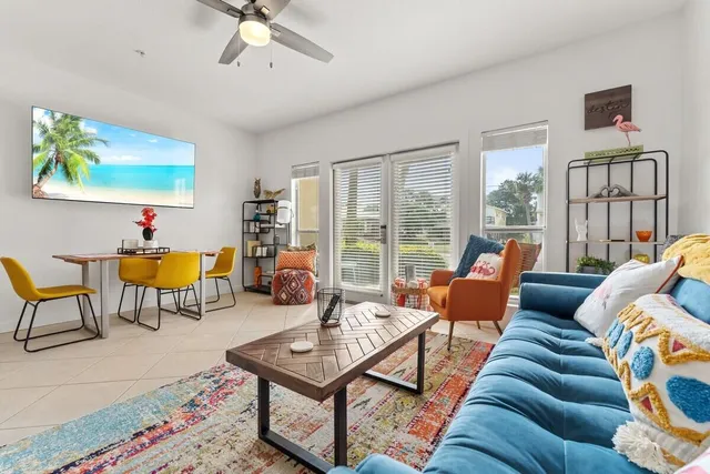 a living room with furniture and a large window