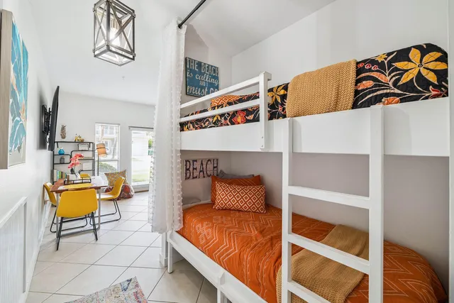 a bedroom with a bed and couch