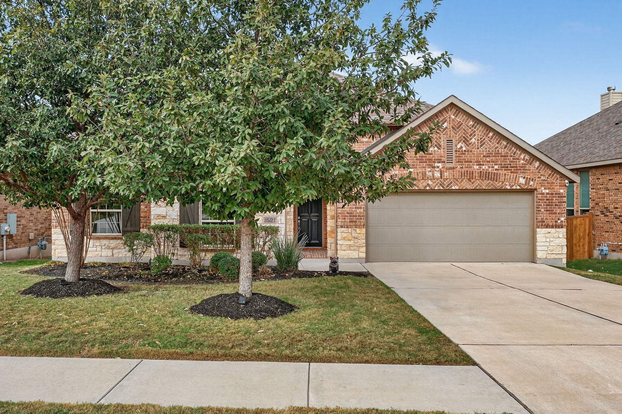 3521 De Soto Loop Round Rock, TX 78665 - Photo 1 of 1 a front view of a house with garden