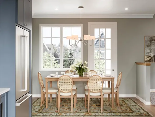 a dining room with furniture a chandelier and wooden floor