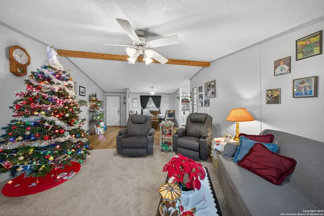 a living room with lots of flower and a fireplace