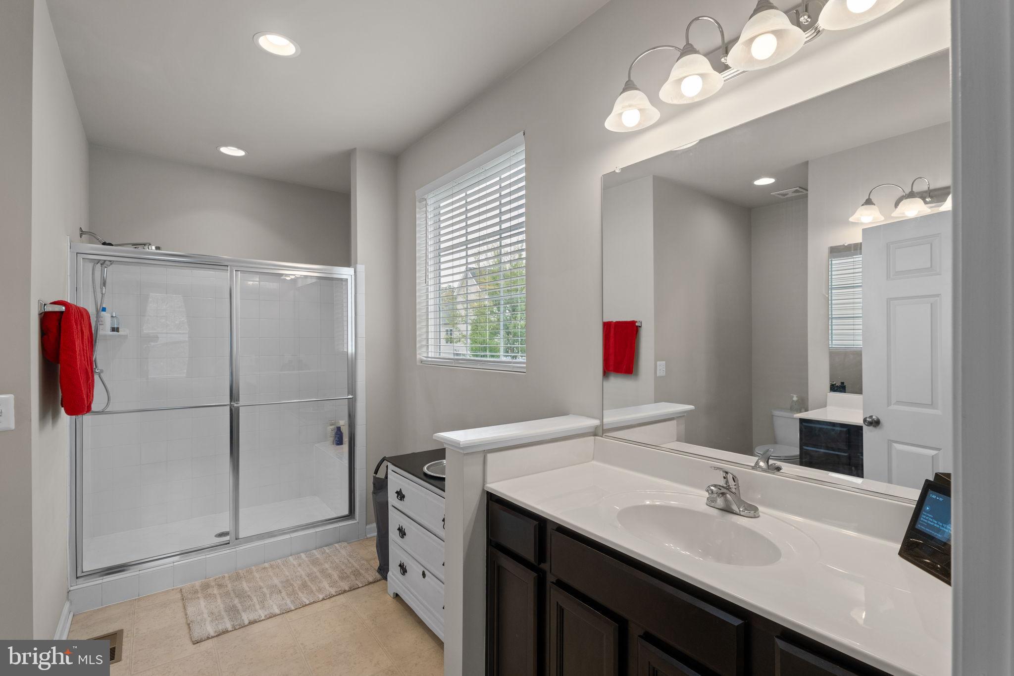 12203 Aster Road Bristow, VA 20136 - Photo 21 of 55 Modern master bathroom with sleek design elements.