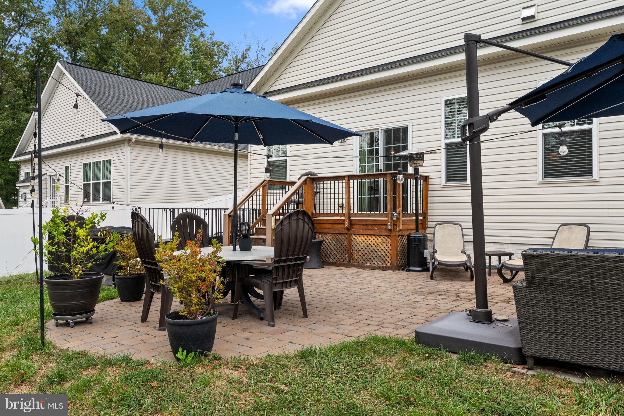 12203 Aster Road Bristow, VA 20136 - Photo 40 of 55 Charming patio retreat with lush greenery.