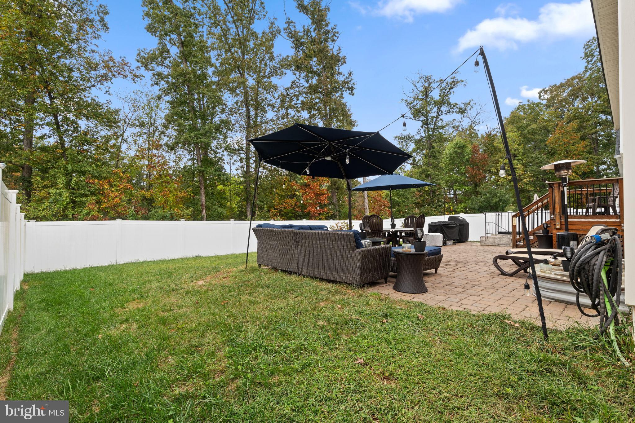 12203 Aster Road Bristow, VA 20136 - Photo 43 of 55 Serene backyard oasis with shaded seating.