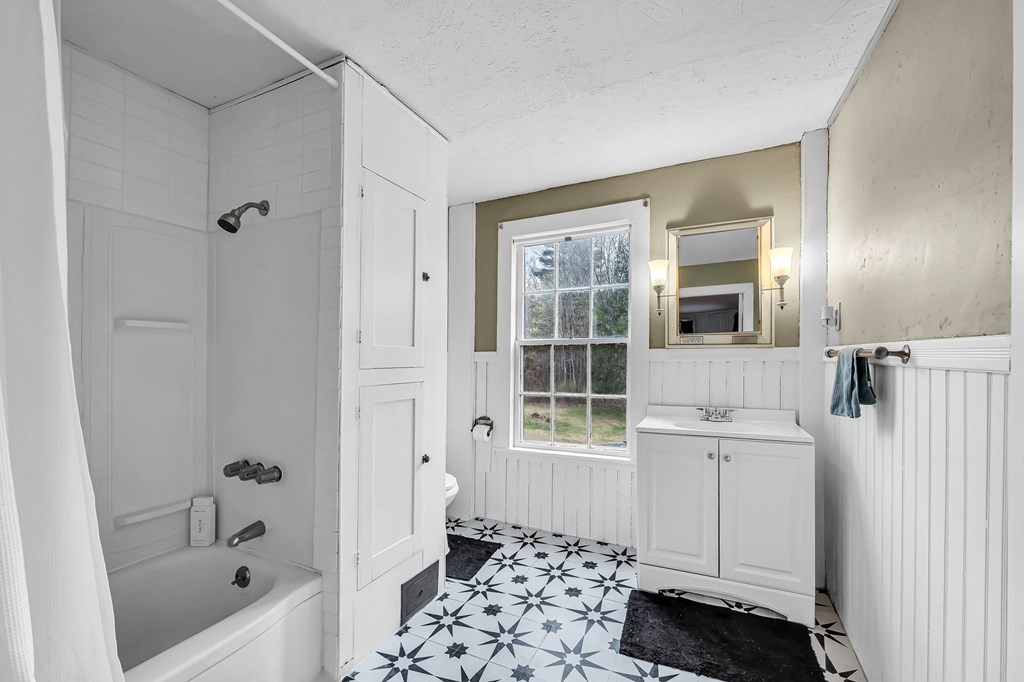 79 Worthington Road Huntington, MA 01050 - Photo 27 of 42 a bathroom with a sink a toilet and shower