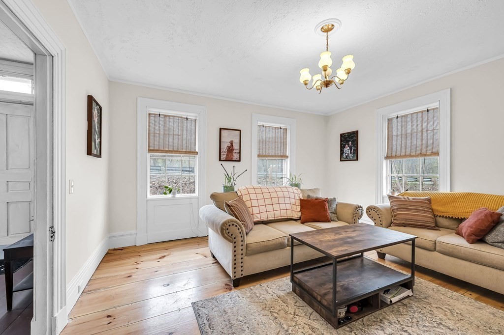79 Worthington Road Huntington, MA 01050 - Photo 5 of 42 a living room with furniture a dining table and a window