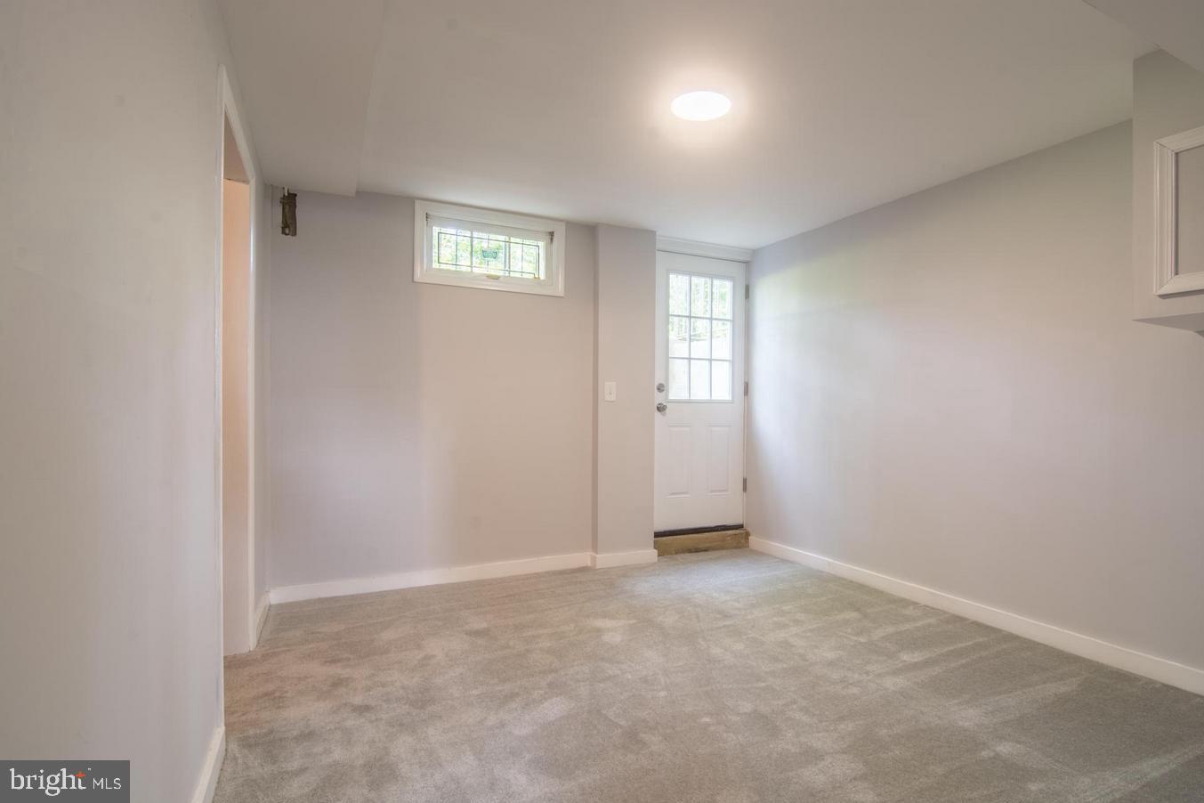 2436 Smith Avenue Baltimore, MD 21209 - Photo 12 of 14 an empty room with windows and closet