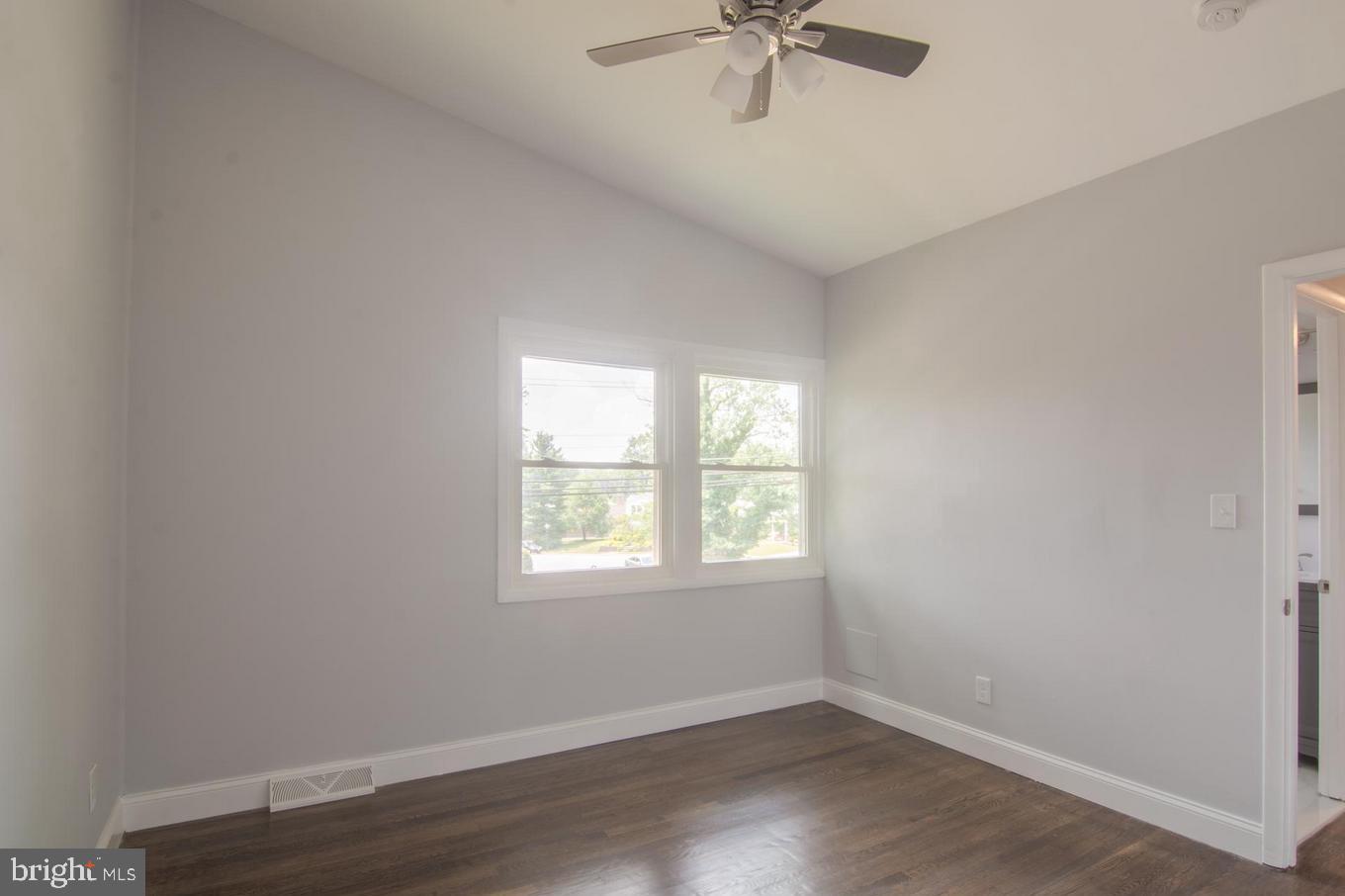 2436 Smith Avenue Baltimore, MD 21209 - Photo 5 of 14 an empty room with a window