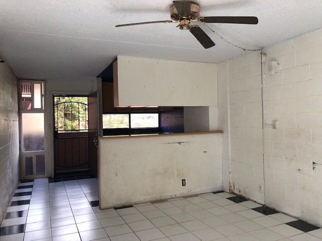 3676 Lower Honoapiilani Road, Unit G203 Lahaina, HI 96761 - Photo 9 of 14 a view of an empty room with window and wooden floor