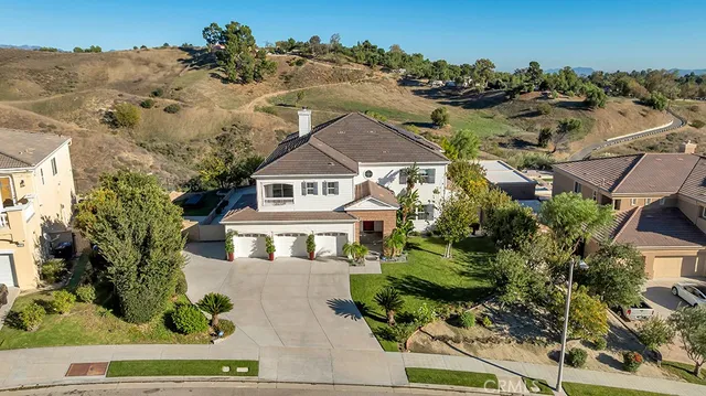 a kitchen with stainless steel appliances kitchen island granite countertop a stove a sink and a microwave
