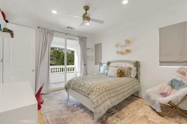 a view of a house with a big yard and large trees