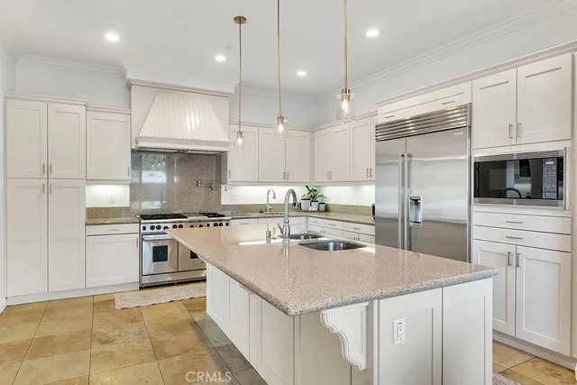 a dining room with furniture a kitchen and kitchen view