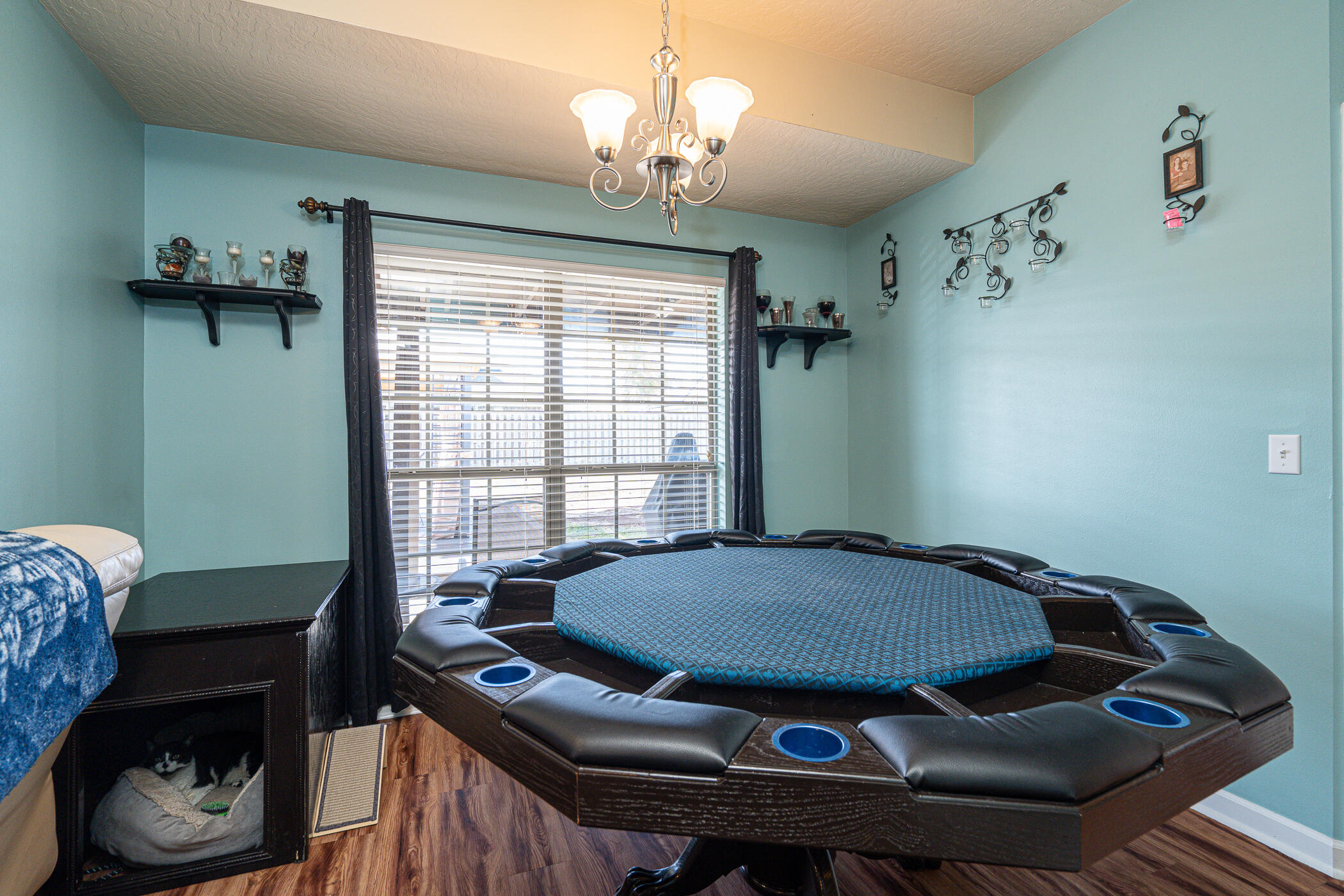 5269 Moore Loop Crestview, FL 32536 - Photo 11 of 36 a living room with furniture and a chandelier