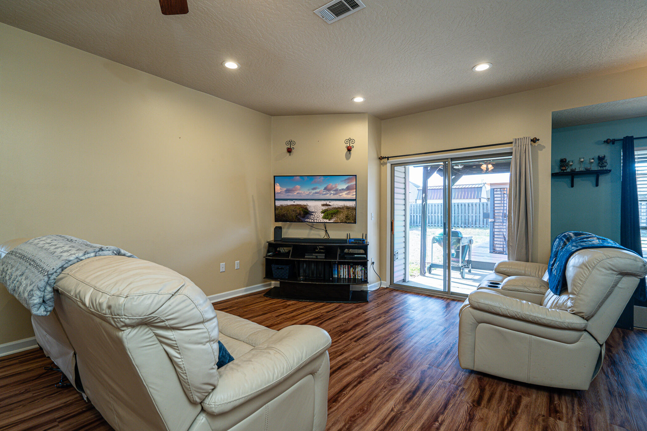 5269 Moore Loop Crestview, FL 32536 - Photo 13 of 36 a living room with furniture and a flat screen tv
