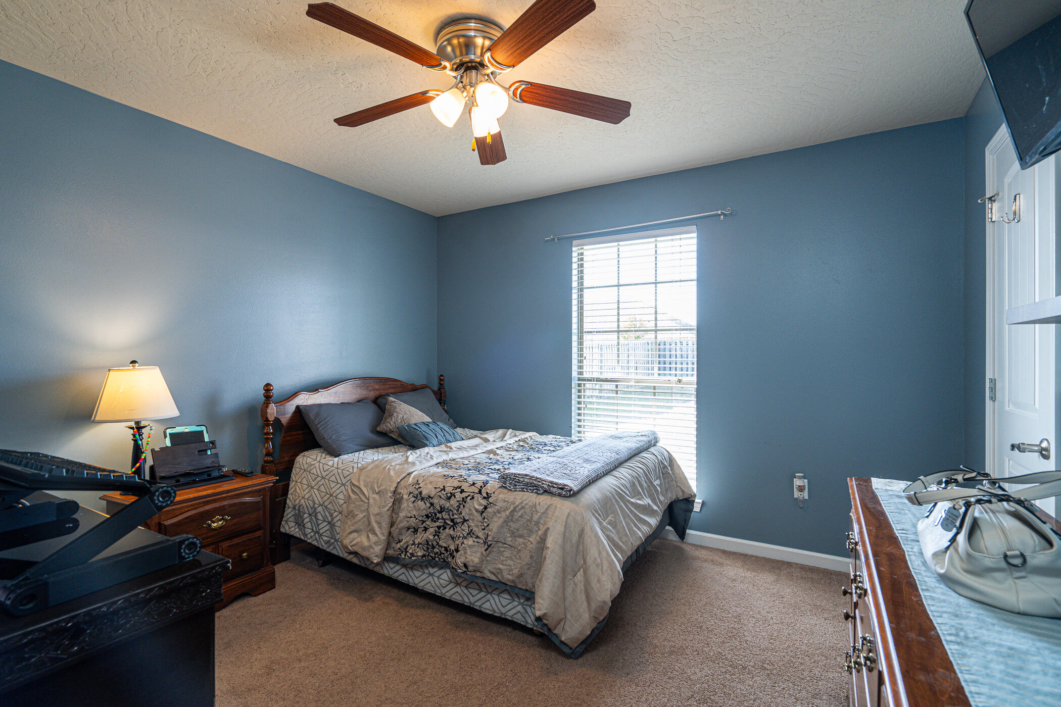 5269 Moore Loop Crestview, FL 32536 - Photo 18 of 36 a bedroom with a bed and a chandelier