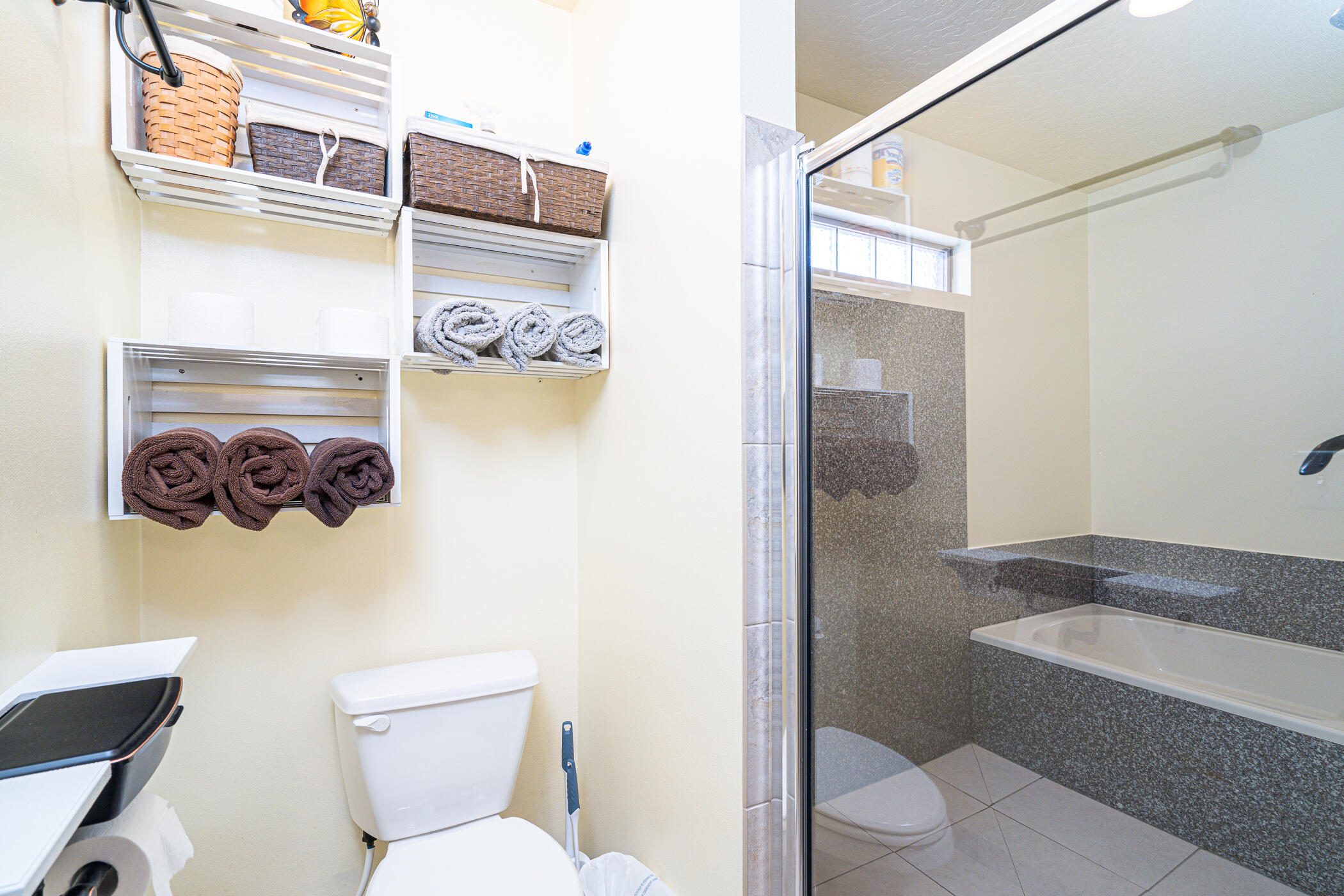 5269 Moore Loop Crestview, FL 32536 - Photo 21 of 36 a white toilet sitting next to a bathroom sink and vanity