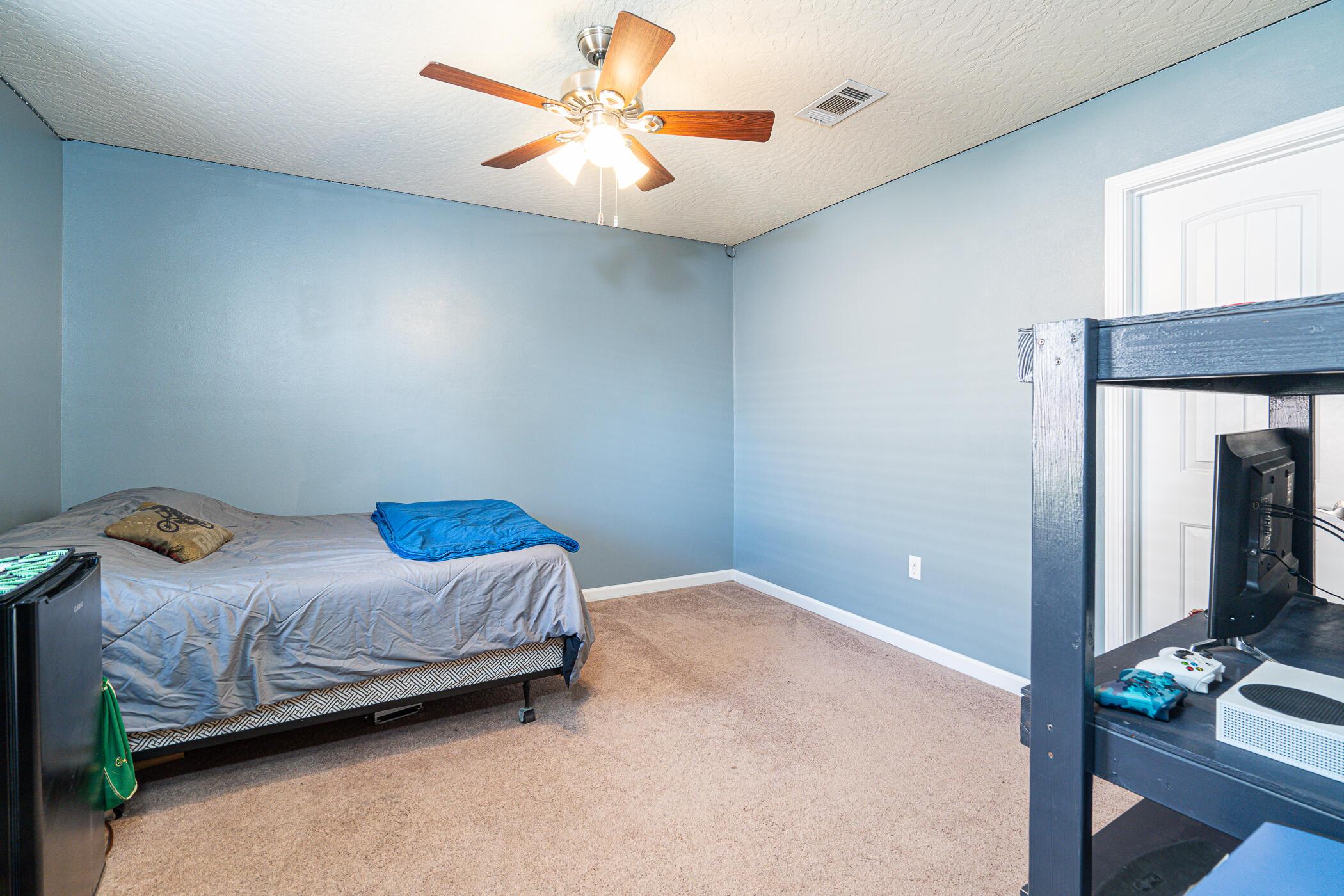 5269 Moore Loop Crestview, FL 32536 - Photo 28 of 36 a bedroom with a bed and a chandelier