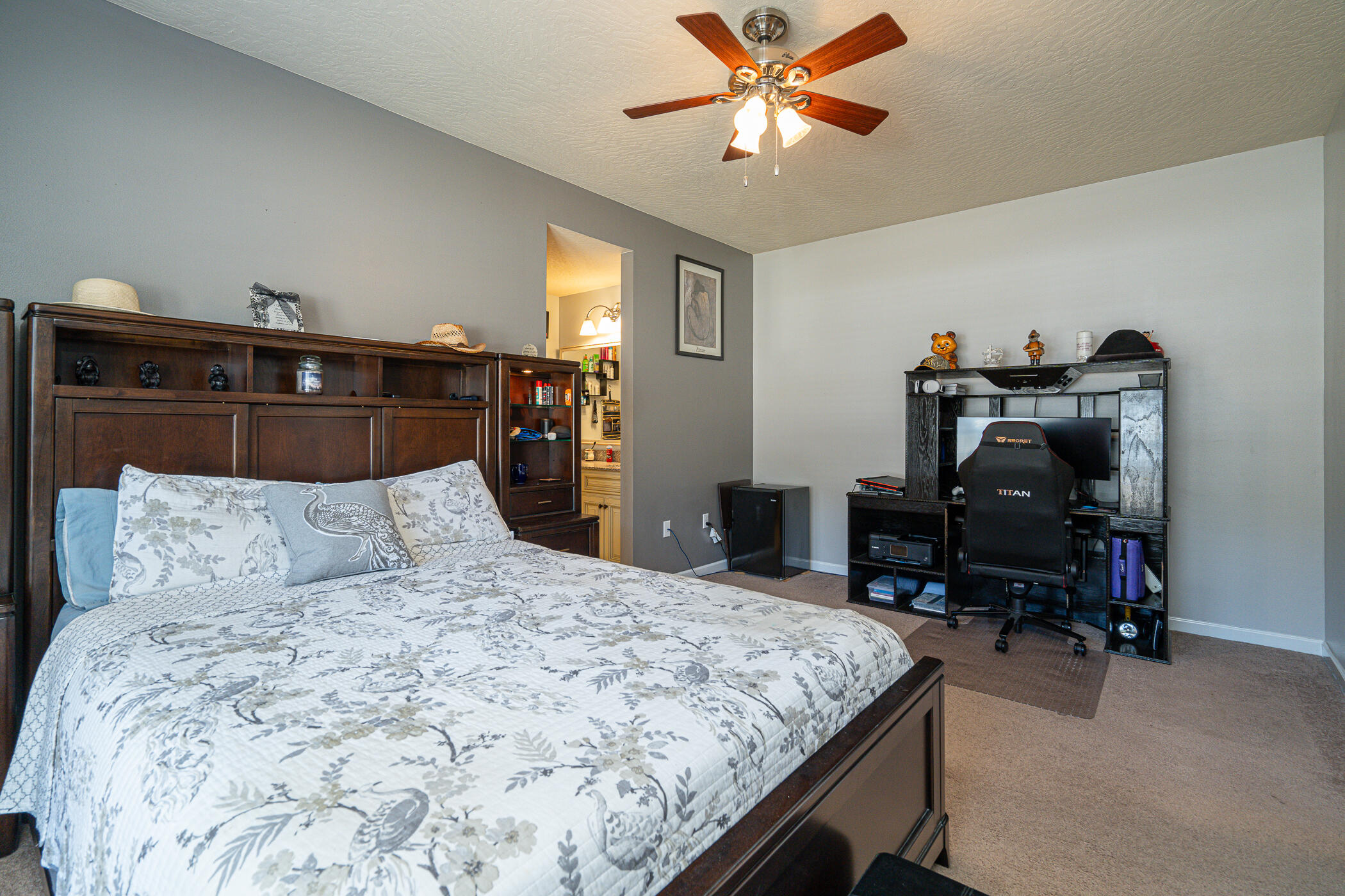 5269 Moore Loop Crestview, FL 32536 - Photo 30 of 36 a bedroom with a bed and a chandelier