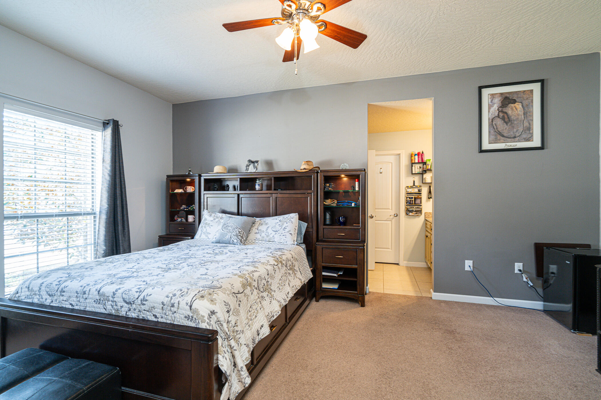 5269 Moore Loop Crestview, FL 32536 - Photo 32 of 36 a bedroom with a bed and a chandelier
