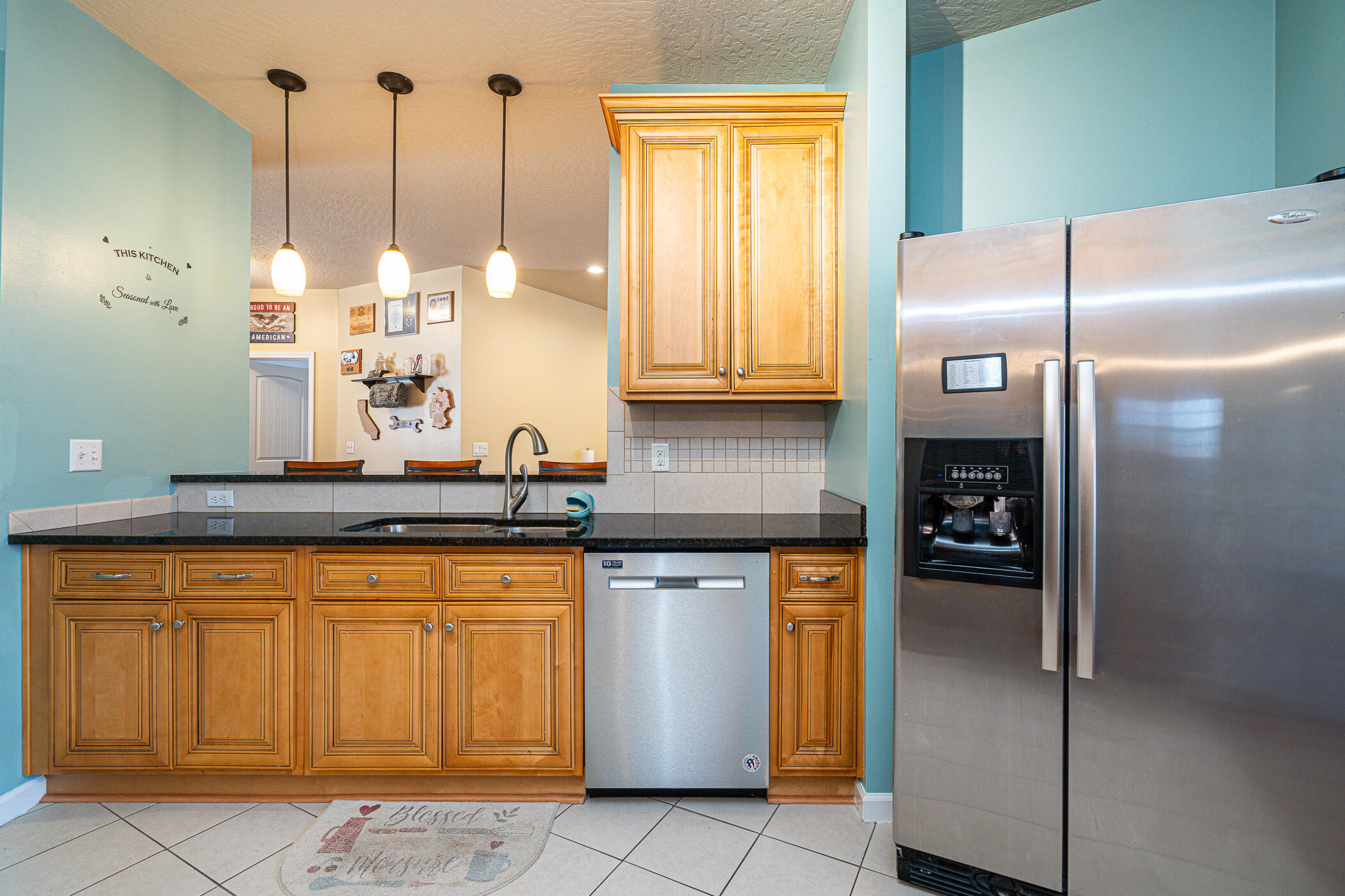 5269 Moore Loop Crestview, FL 32536 - Photo 8 of 36 a kitchen with stainless steel appliances granite countertop a refrigerator a sink and dishwasher