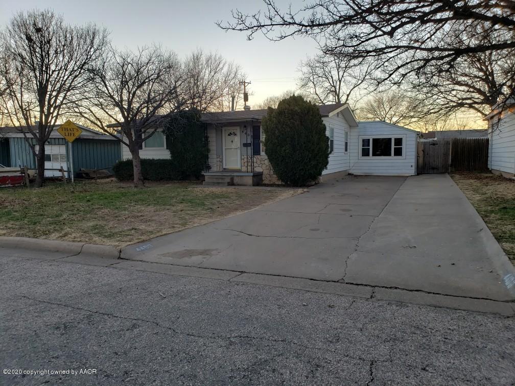 4408 South Ong Street Amarillo, TX 79110 - Photo 1 of 23 a front view of a house with a yard and garage