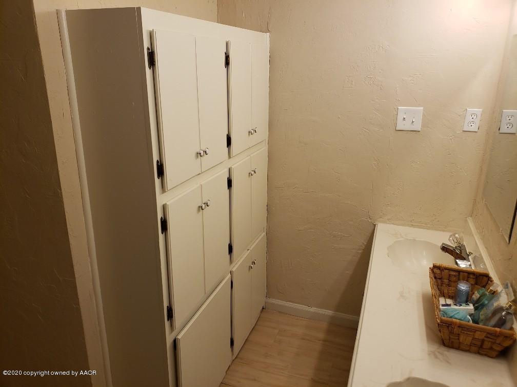 4408 South Ong Street Amarillo, TX 79110 - Photo 11 of 23 a bathroom with a sink and a shower