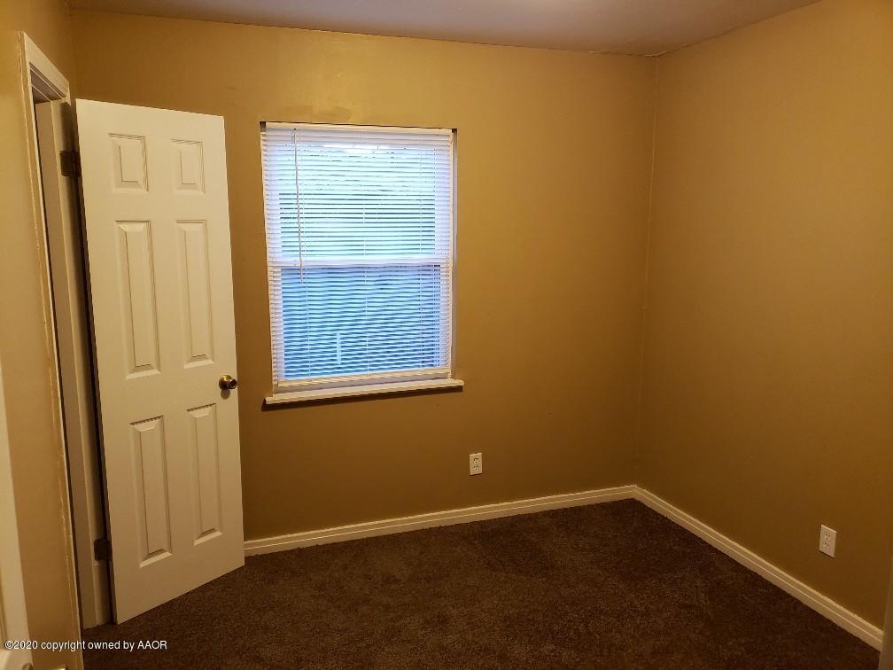 4408 South Ong Street Amarillo, TX 79110 - Photo 16 of 23 a view of an empty room with a window