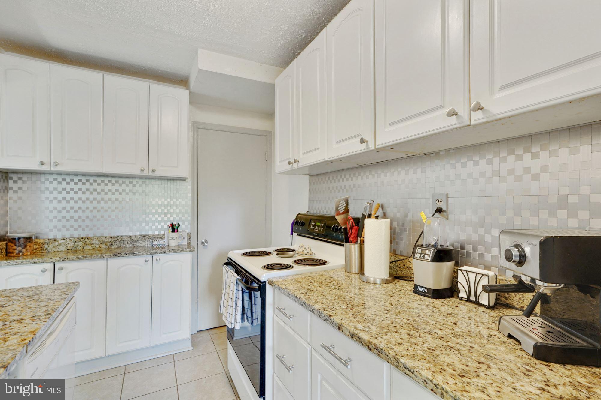 5927 Williamsburg Road Alexandria, VA 22303 - Photo 7 of 38 White Kitchen Cabinets Provide Great Storage