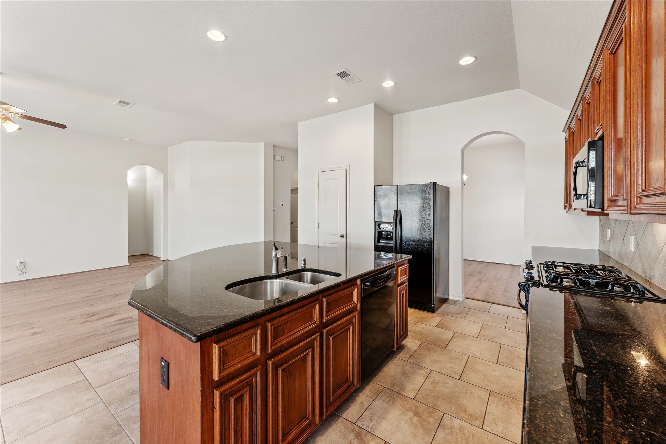 1602 Eden Meadows Drive Spring, TX 77386 - Photo 18 of 42 a kitchen with stainless steel appliances granite countertop a sink and cabinets
