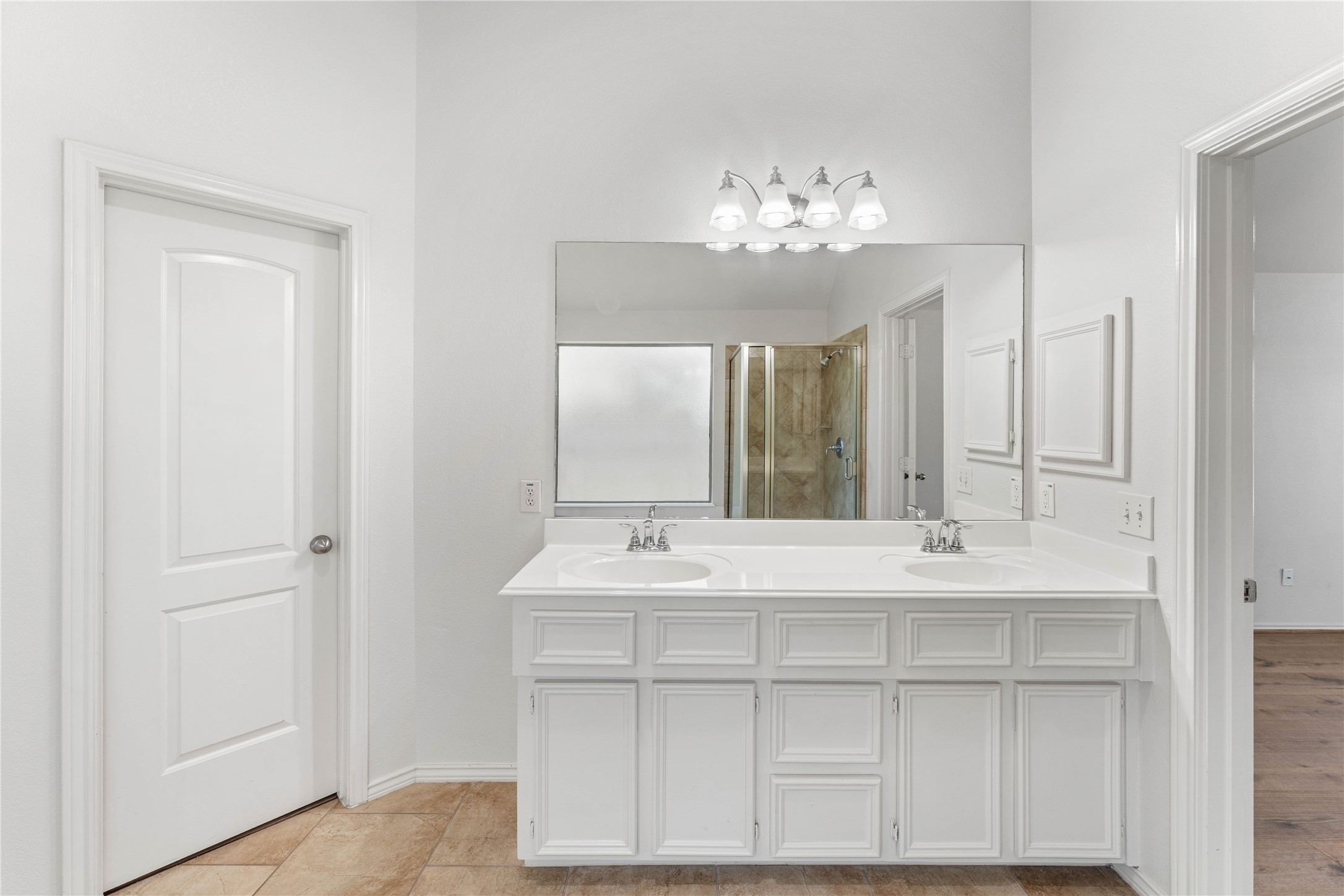 1602 Eden Meadows Drive Spring, TX 77386 - Photo 26 of 42 a bathroom with a sink vanity and a mirror