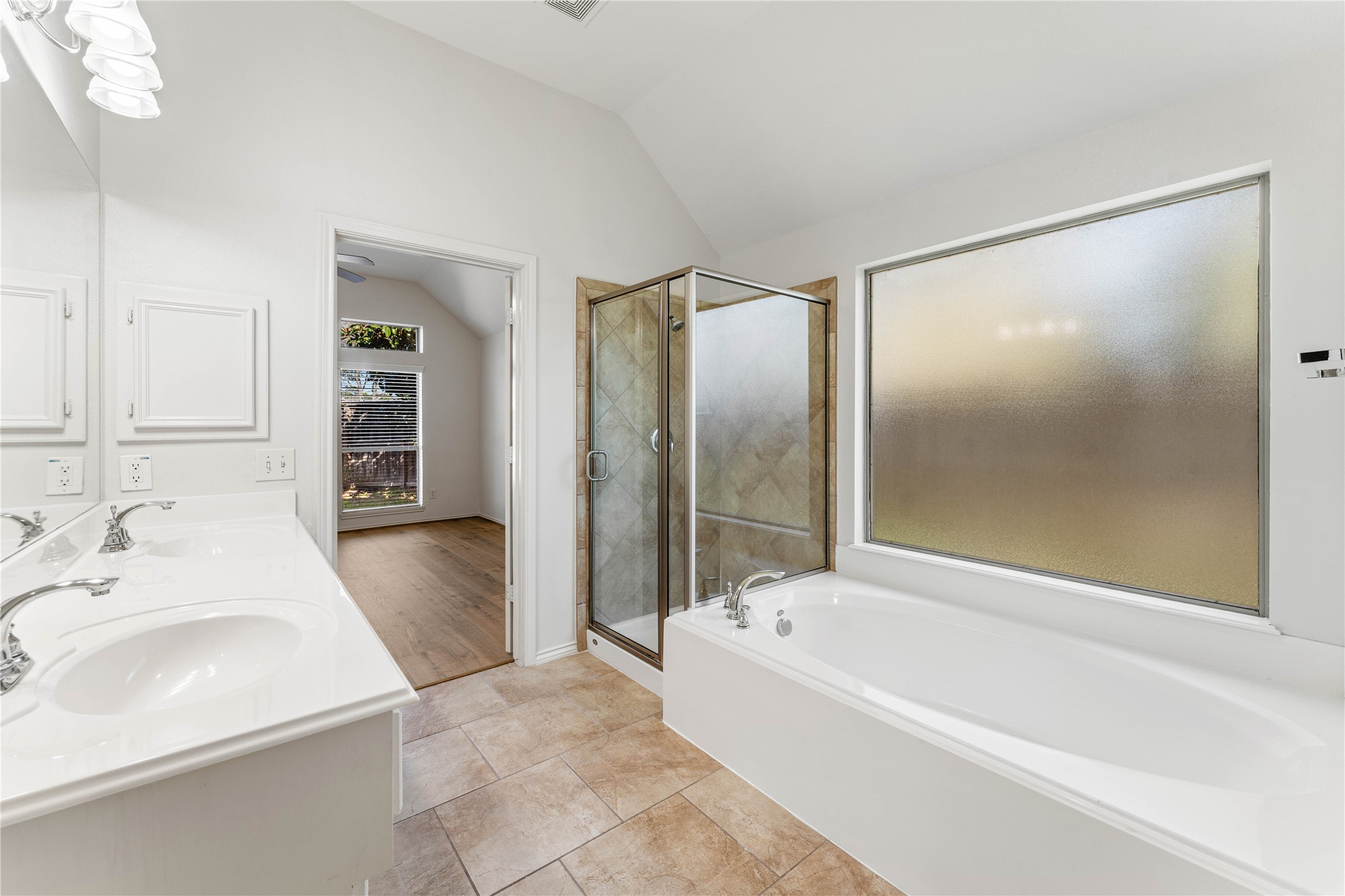 1602 Eden Meadows Drive Spring, TX 77386 - Photo 27 of 42 a bathroom with a bathtub and a sink