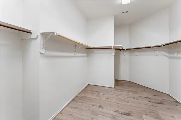 a view of a room with shelf on the wall
