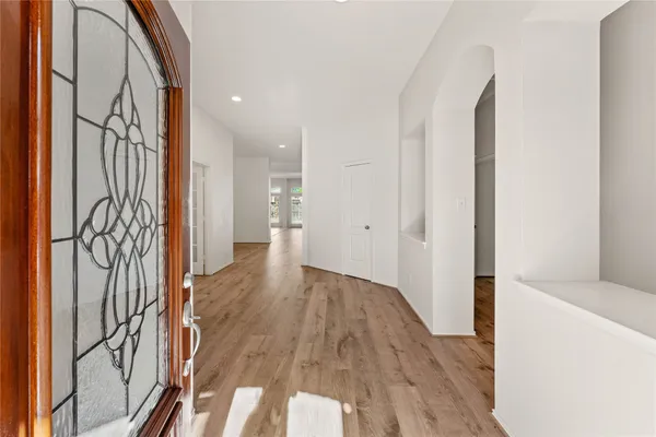 a view of entryway with wooden floor