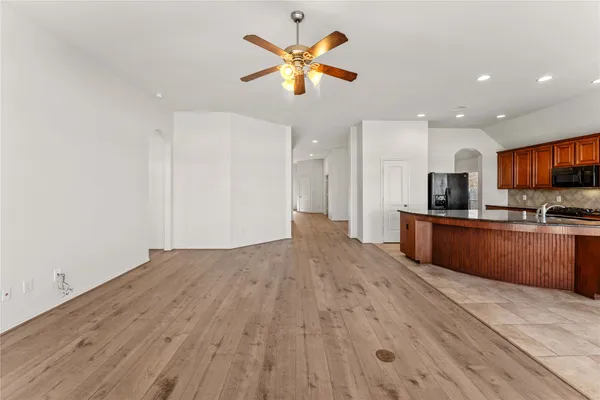 a view of kitchen with wooden floor and window