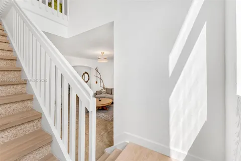 a view of a hallway with staircase