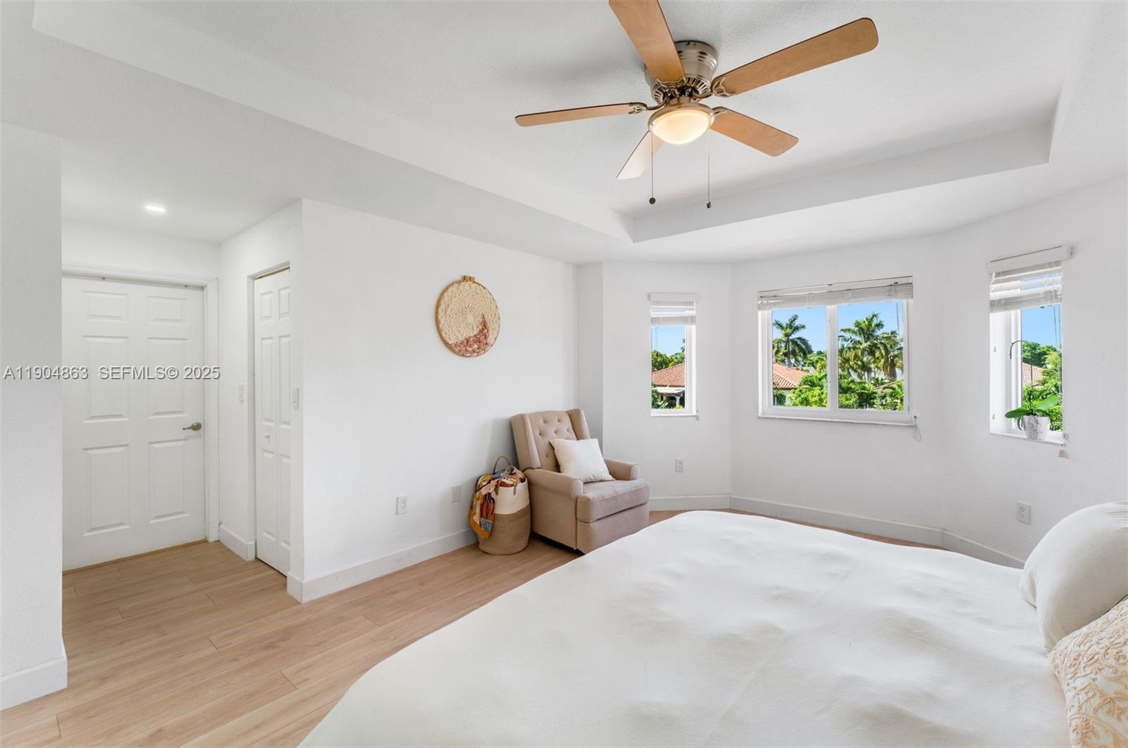17080 Southwest 92nd Court Palmetto Bay, FL 33157 - Photo 20 of 40 a bedroom with a bed and a window