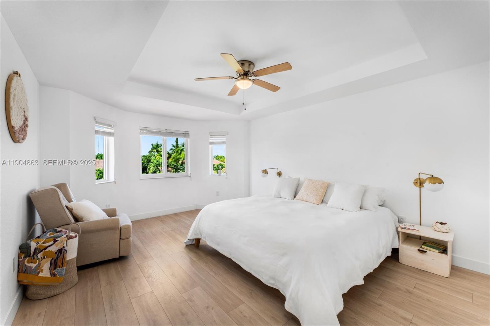 17080 Southwest 92nd Court Palmetto Bay, FL 33157 - Photo 21 of 40 a bedroom with a bed and wooden floor