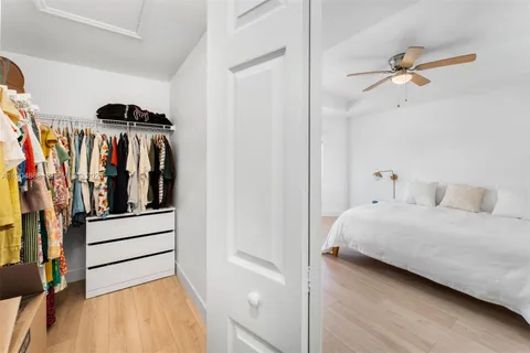 a bedroom with a bed and a view of bathroom