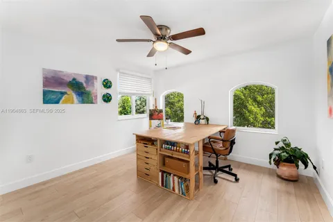 a workspace with furniture and window