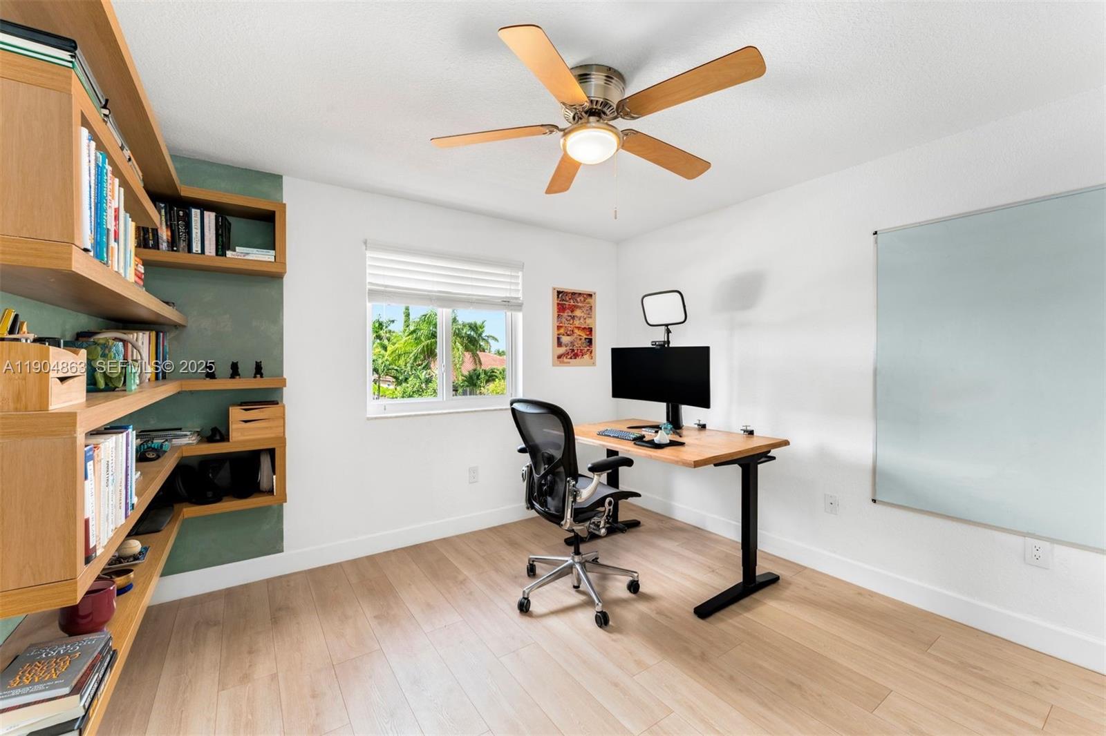 17080 Southwest 92nd Court Palmetto Bay, FL 33157 - Photo 30 of 40 a view of a workspace with furniture and a window