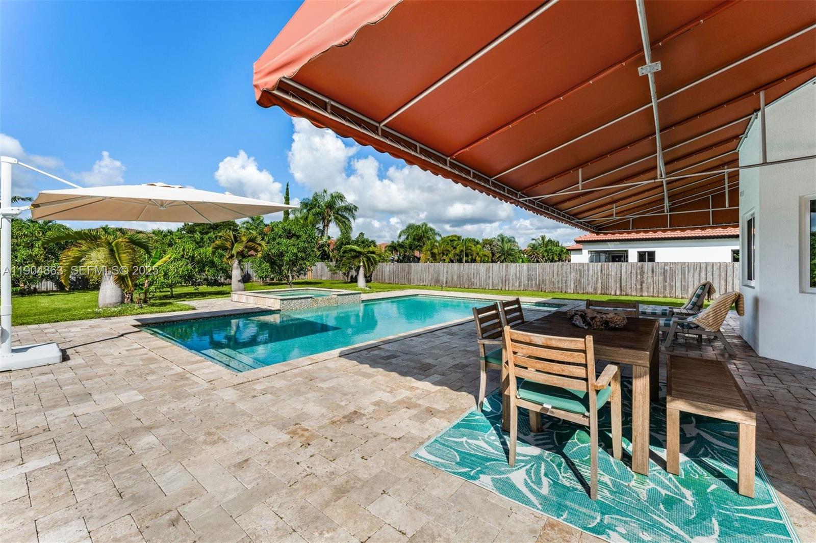 17080 Southwest 92nd Court Palmetto Bay, FL 33157 - Photo 33 of 40 a view of a backyard with sitting area