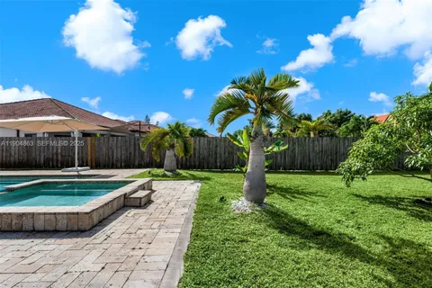 a backyard of a house with lots of green space