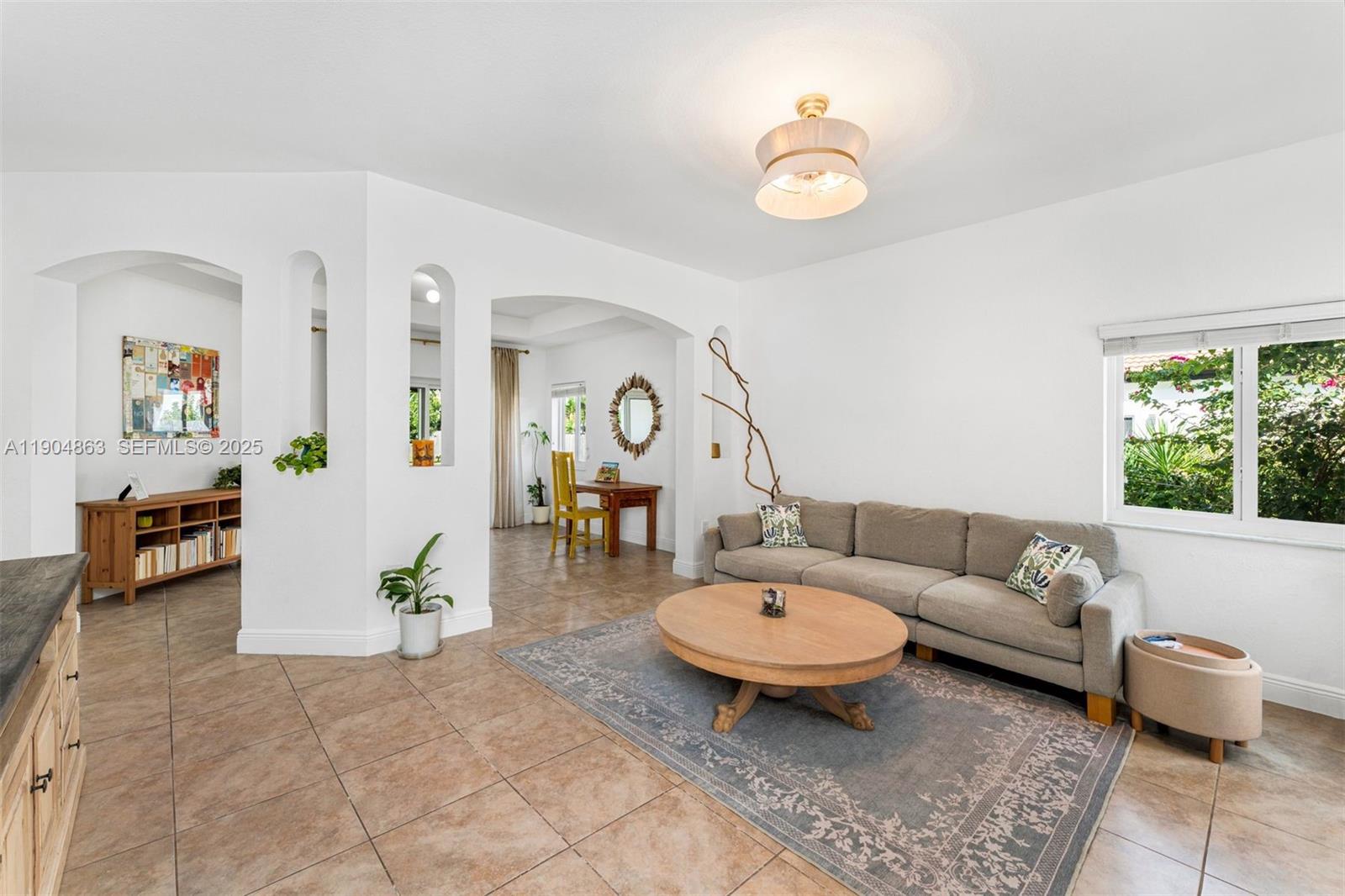 17080 Southwest 92nd Court Palmetto Bay, FL 33157 - Photo 5 of 40 a living room with furniture and a table