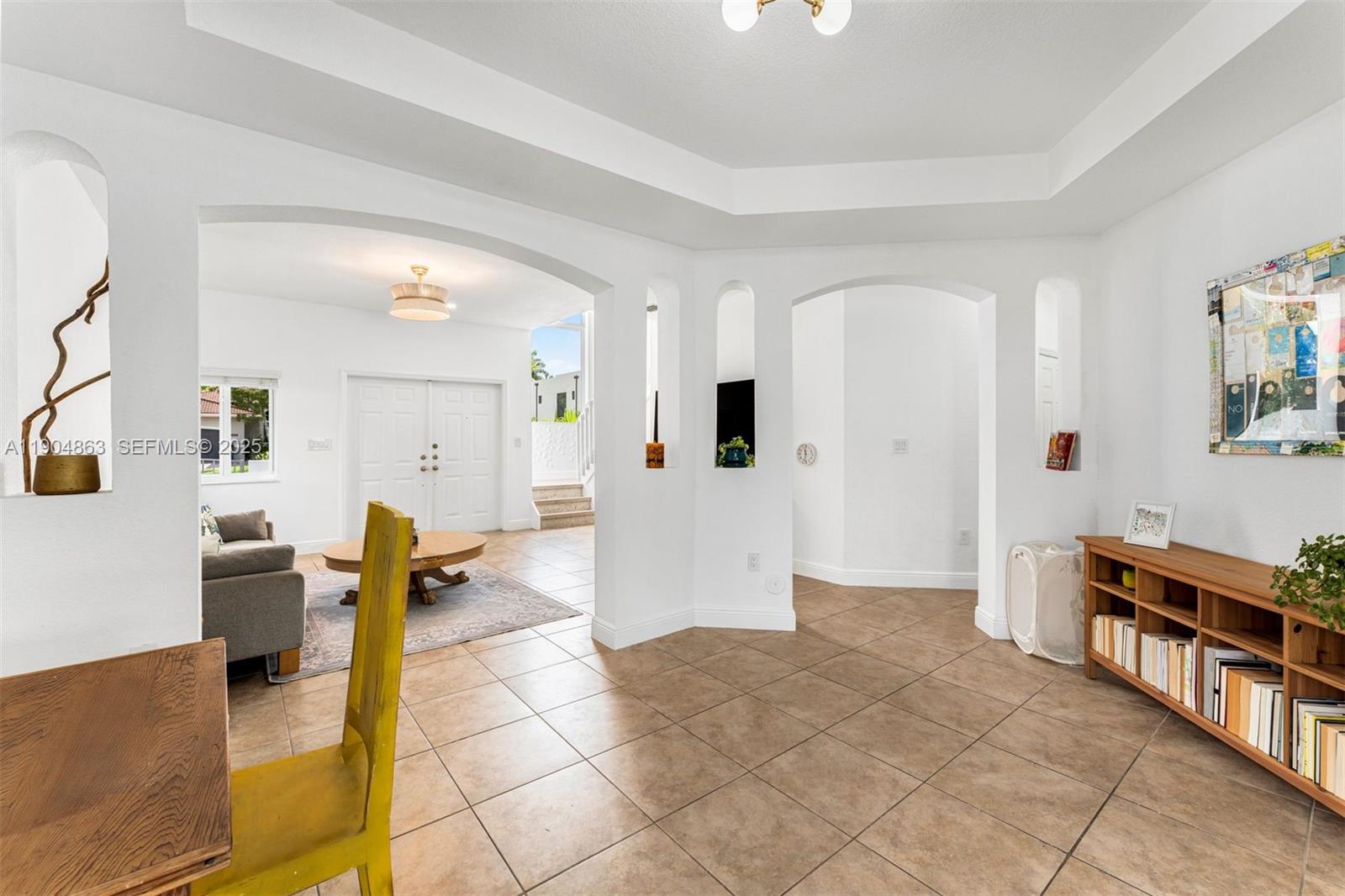 17080 Southwest 92nd Court Palmetto Bay, FL 33157 - Photo 7 of 40 a living room with furniture and a table
