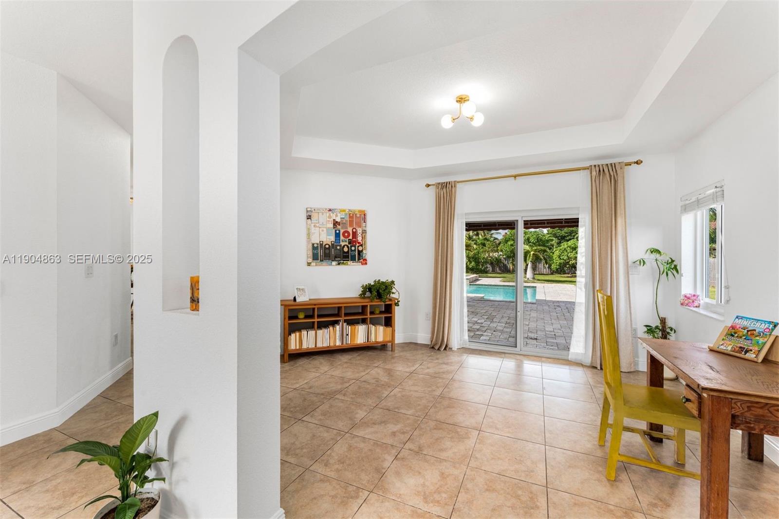 17080 Southwest 92nd Court Palmetto Bay, FL 33157 - Photo 8 of 40 a living room with furniture and a window