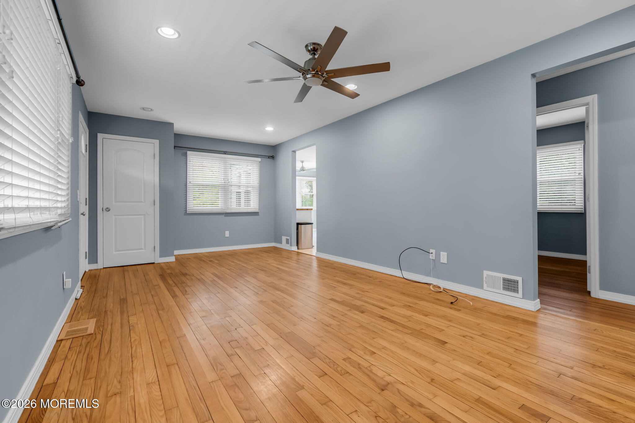 593 Beach Plum Road Brick, NJ 08723 - Photo 11 of 38 wooden floor in an empty room with a window